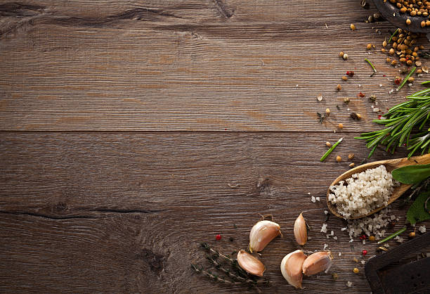 istock Various herbs and spices on dark wood table 614744774
