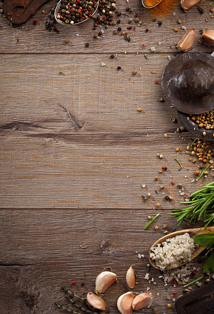 istock Various herbs and spices on dark wood table 614744904
