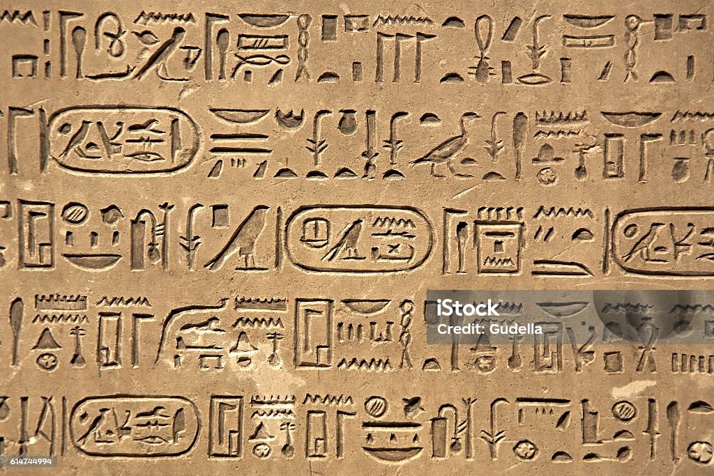 Ancient Hieroglyphic Script Egiptian hieroglyphs carved in sandstone Hieroglyphics Stock Photo