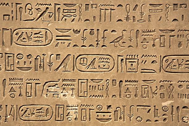 Ancient Hieroglyphic Script Egiptian hieroglyphs carved in sandstone hieroglyphics photos stock pictures, royalty-free photos & images