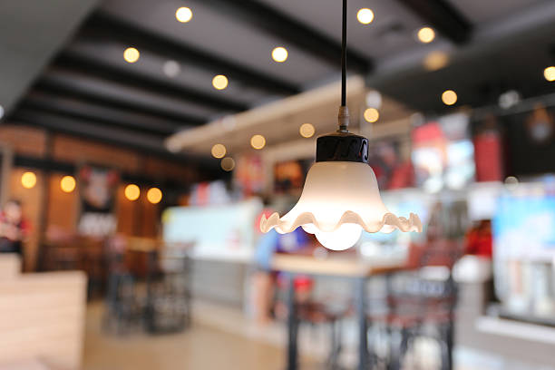 istock Warm lighting modern ceiling lamps in the cafe. 614745148