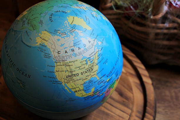 istock Earth ball on wood plate 614745628