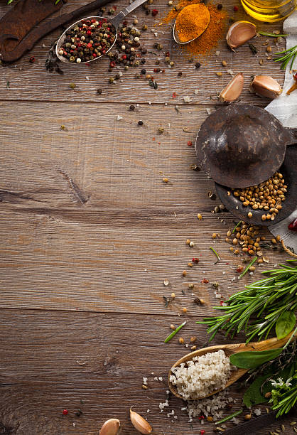 istock Various herbs and spices on dark wood table 614745646
