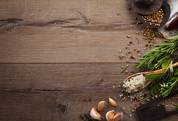istock Various herbs and spices on dark wood table 614745750