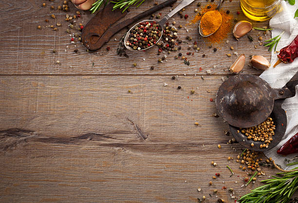 istock Various herbs and spices on dark wood table 614745856