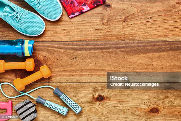 Directly Above Shot Of Sports Equipment On Hardwood Floor Stock Photo - Download Image Now