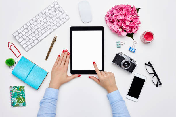 istock Blogger using digital tablet by desk supplies on white backgroun 614745952