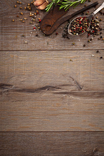 istock Various herbs and spices on dark wood table 614746202