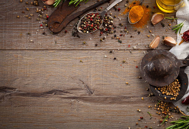 istock Various herbs and spices on dark wood table 614746272