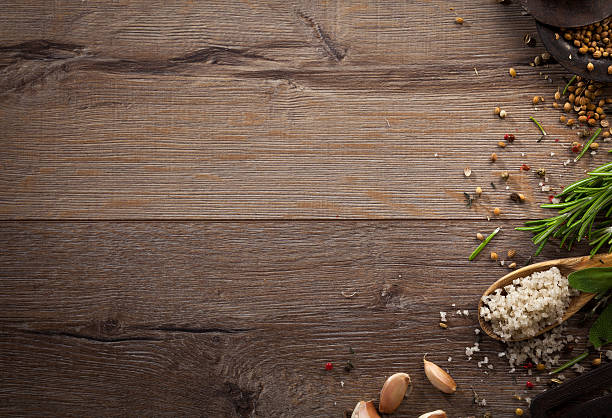 istock Various herbs and spices on dark wood table 614746322