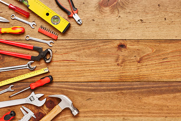 istock Various carpentry tools on left side of wooden floor 614746334