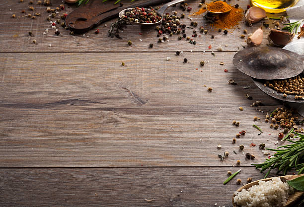 istock Various herbs and spices on dark wood table 614746382