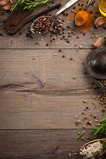 istock Various herbs and spices on dark wood table 614746454