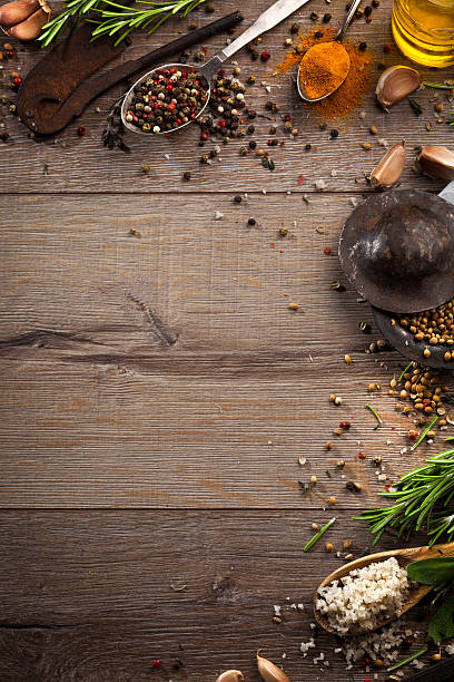 istock Various herbs and spices on dark wood table 614746558