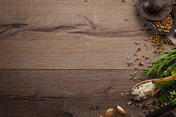 istock Various herbs and spices on dark wood table 614746664