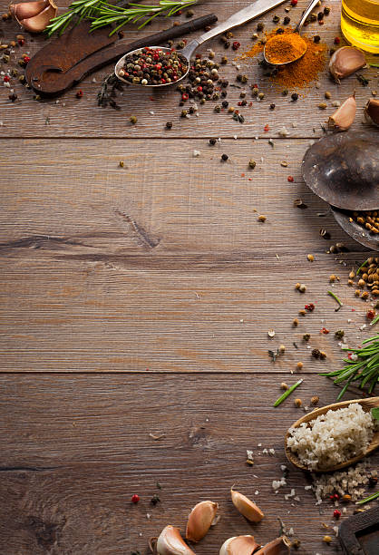 istock Various herbs and spices on dark wood table 614746930