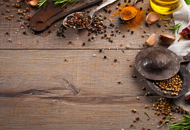 istock Various herbs and spices on dark wood table 614747066