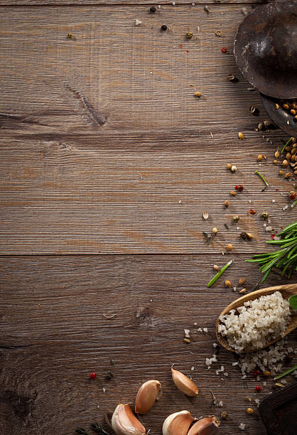 istock Various herbs and spices on dark wood table 614747202