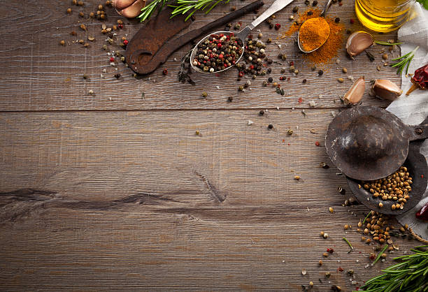 istock Various herbs and spices on dark wood table 614747372