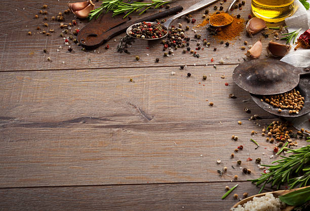 istock Various herbs and spices on dark wood table 614747484