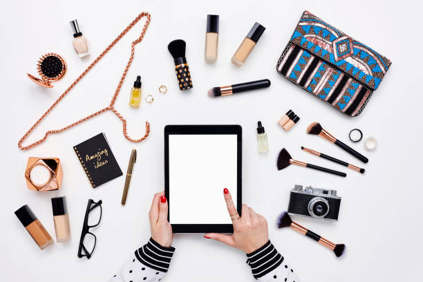 istock Blogger using digital tablet surrounded with beauty products 614747576