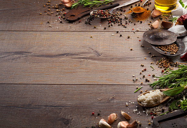 istock Various herbs and spices on dark wood table 614747604