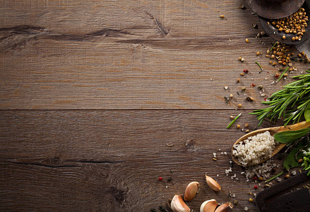 istock Various herbs and spices on dark wood table 614747710