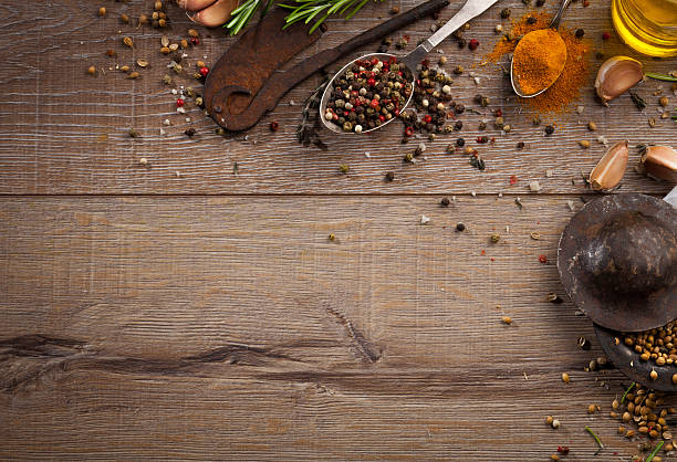 istock Various herbs and spices on dark wood table 614747884