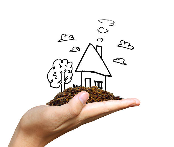 istock Business man house in  hands 614747972
