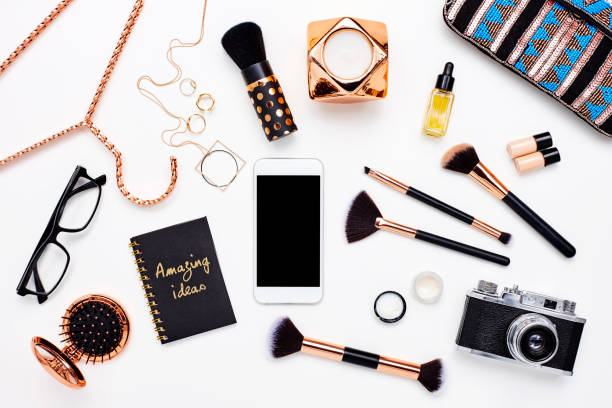 istock Smart phone surrounded with beauty products on white background 614748238
