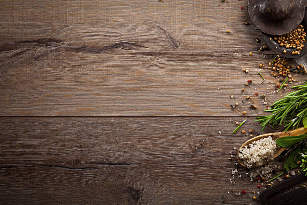 istock Various herbs and spices on dark wood table 614748372