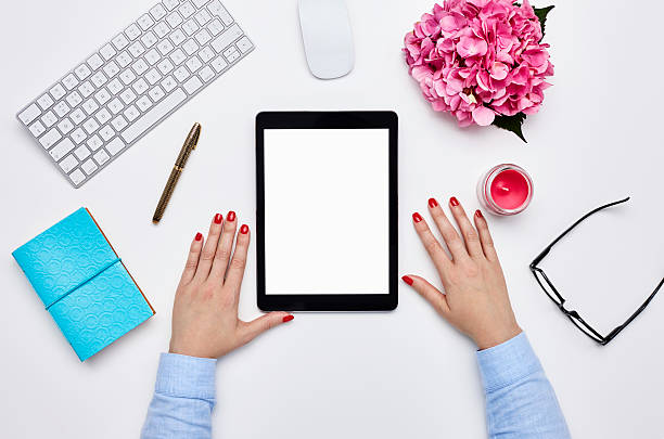 istock Bloggers hands with digital tablet and office supply against white background 614748456