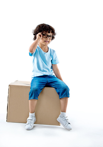 Group of emotional kids in retro style summer outfit sitting together isolated on white background. Concept of kids emotions, facial expression, beauty, childhood. Copy space for ad