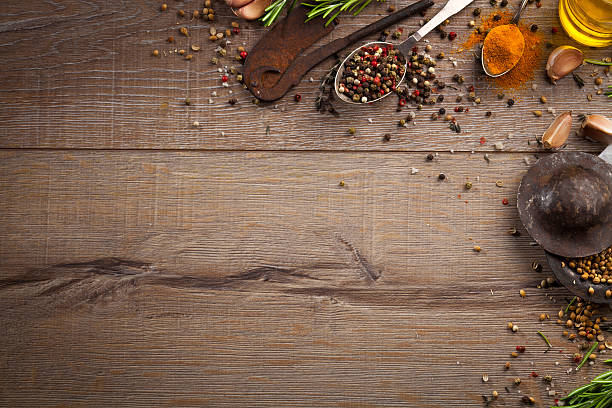 istock Various herbs and spices on dark wood table 614748890