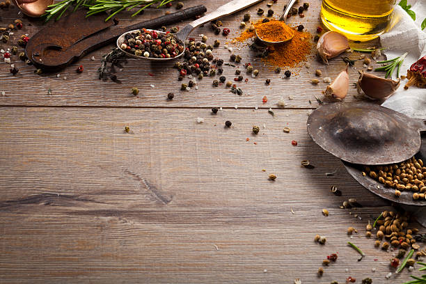 istock Various herbs and spices on dark wood table 614749150