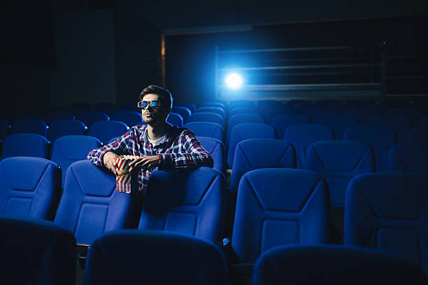 istock Man is alone in cinema 614832248