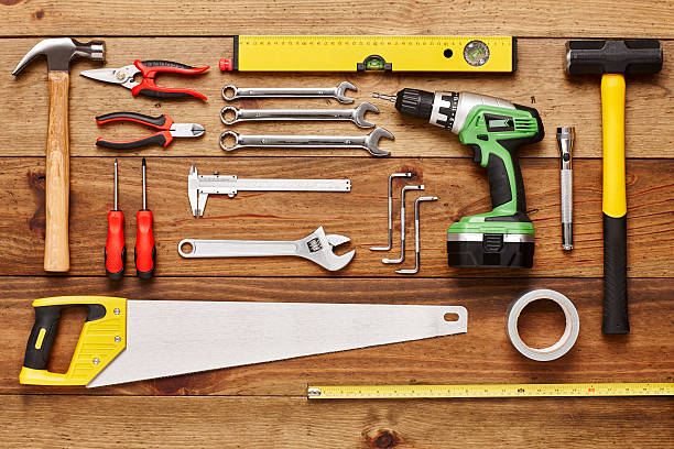 istock Construction tools are arranged on wooden floor - Knolling 614832584