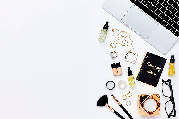 istock Various beauty products with diary and laptop on white 614832876