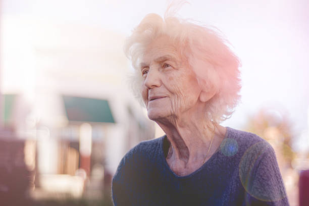 istock Beautiful Senior Woman Lost in Thoughts 614833558