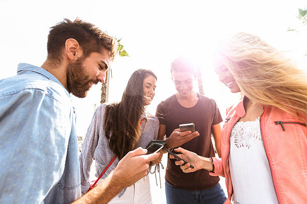 istock social media addiction people using the smartphone in barcelona 614834522