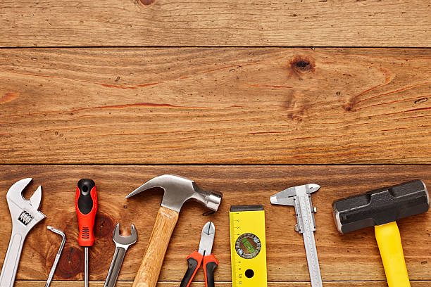 istock Directly above shot of various DIY tools on wooden floor 614834560