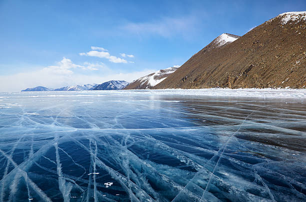 istock Winter ice landscape on Siberian lake Baikal with clouds 614835270