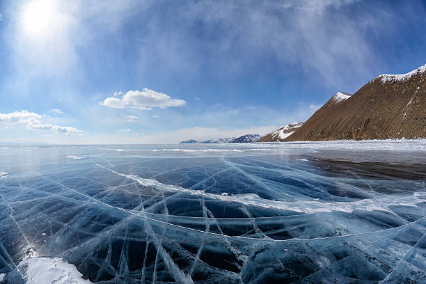 istock Winter ice landscape on Siberian lake Baikal with clouds 614835302