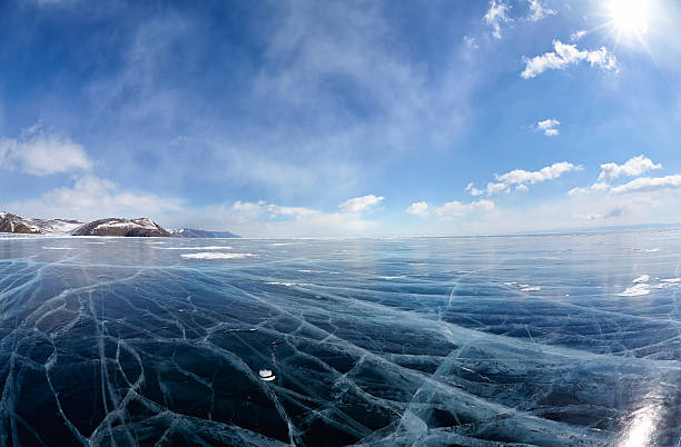 istock Winter ice landscape on Siberian lake Baikal with clouds 614835318