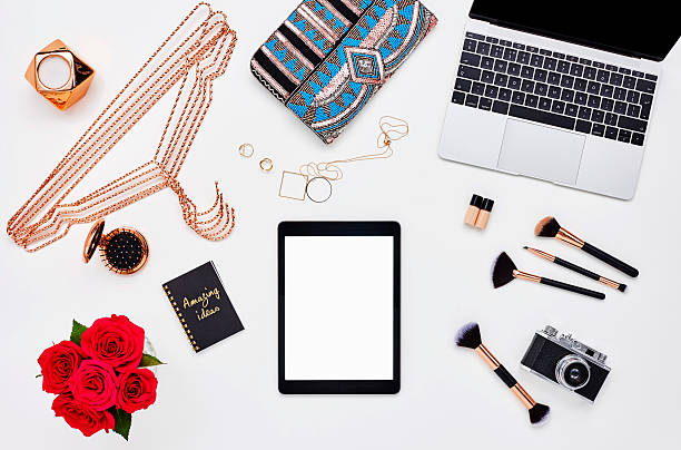 Flat lay with beauty and make-up accessories on bloggers desk