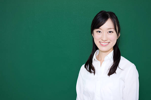 istock Teacher standing in front of blackboard 614838100