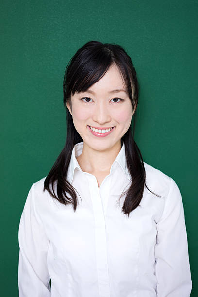 istock Teacher standing in front of blackboard 614838172