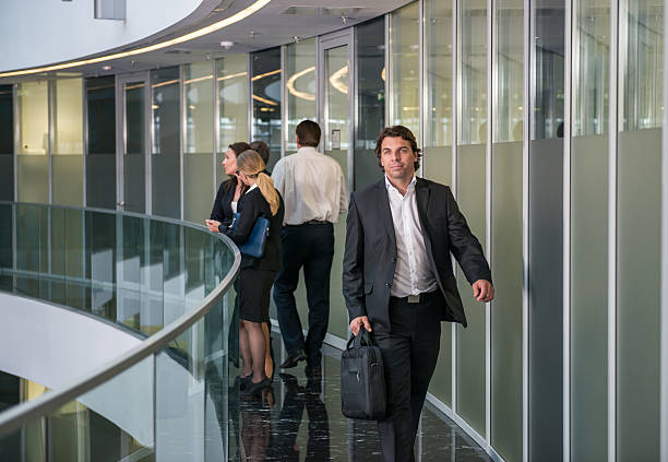 istock Busy People In Business Center 614840044