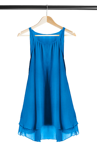 Blue chiffon dress on clothes rack isolated over white