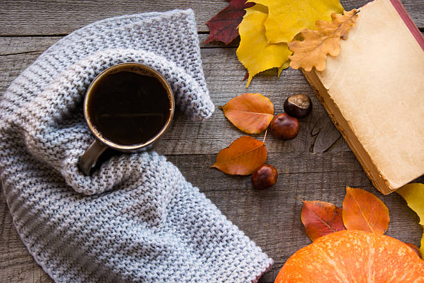 istock Coffee, autumn leaves and pumpkin on board. Flat lay. 614843024